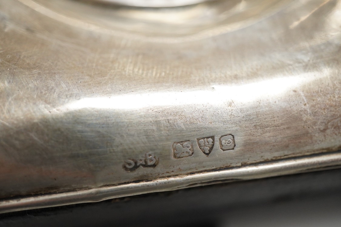 Two Edwardian silver mounted leather travelling watch cases, Chester 1905 and Birmingham, 1907, both containing a chrome cased keyless pocket watch.